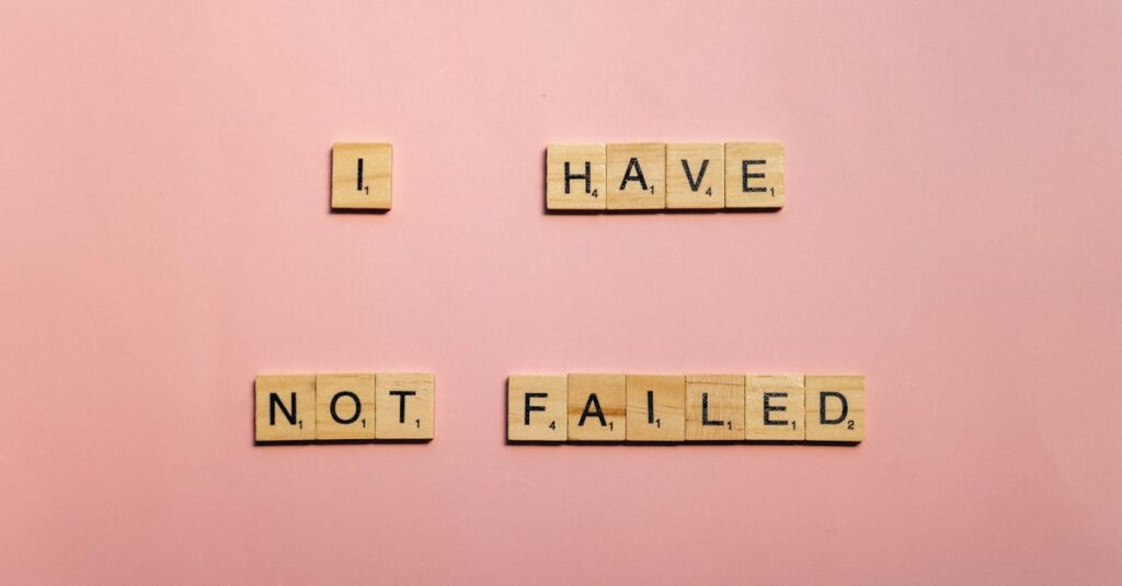 Scrabble tiles spelling 'I have not failed' on a pink background, offering an inspirational message.