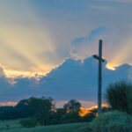 Beautiful sunset with wooden cross in a serene landscape of Frederick, MD, USA.